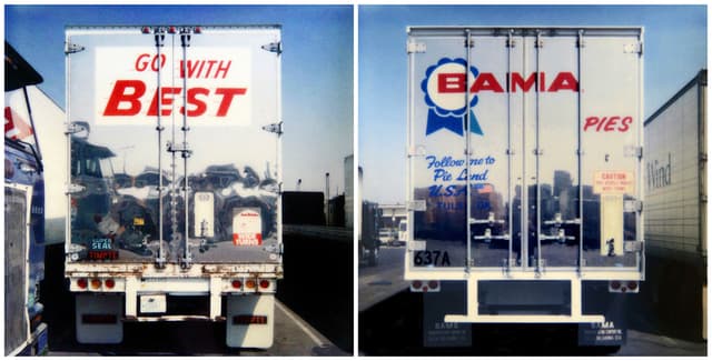 A photo realistic drawing of the back of two lorries, one says 'go with best' and the other says 'BAMA' in red text.