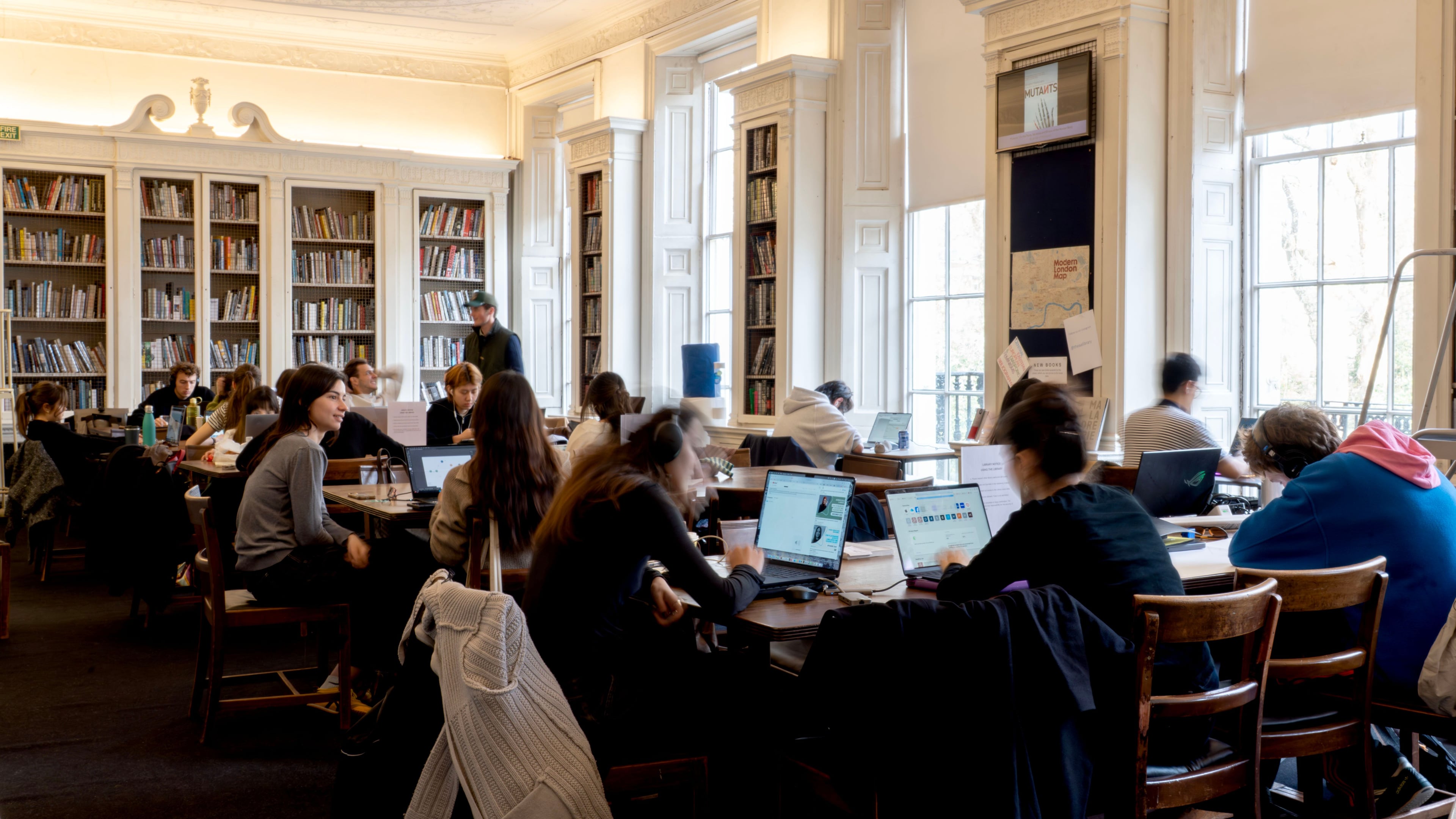 People working at tables in the AA Library
