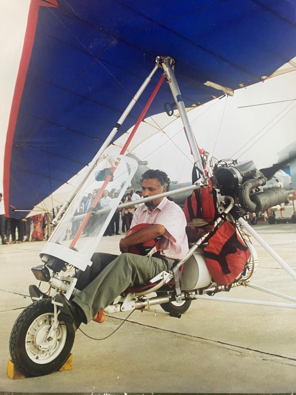 Tom Thomas, with microlight. Photo: Thomas Associates