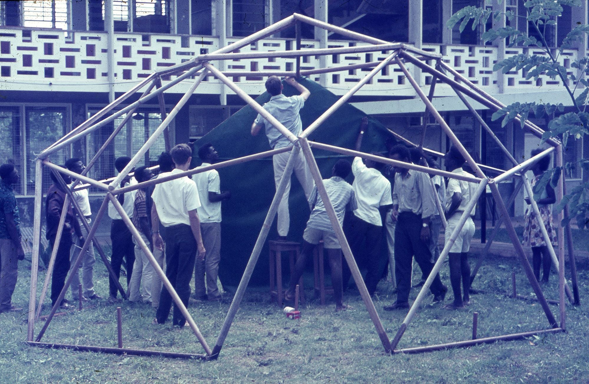 A group of people building a timber structure